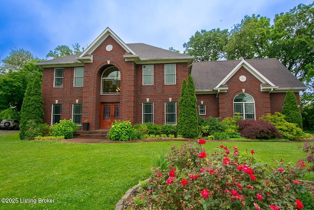 9200 Axminster Dr, Louisville, KY 40299 - view of front of house with brick siding, a front yard, and a shingled roof