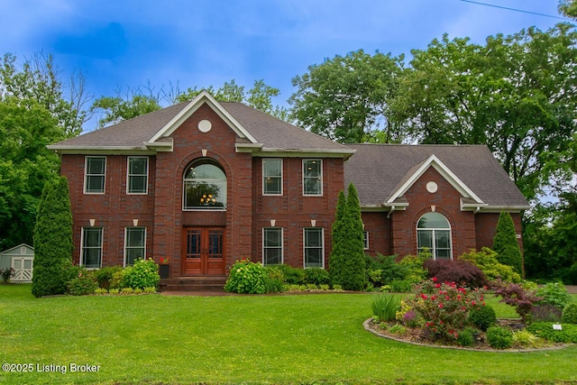 9200 Axminster Dr, Louisville, KY 40299 - view of front of property featuring a front lawn, brick siding, french doors, and roof with shingles