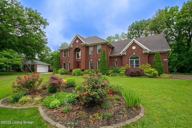 9200 Axminster Dr, Louisville, KY 40299 - georgian-style home featuring brick siding, a front yard, an outbuilding, and a garage