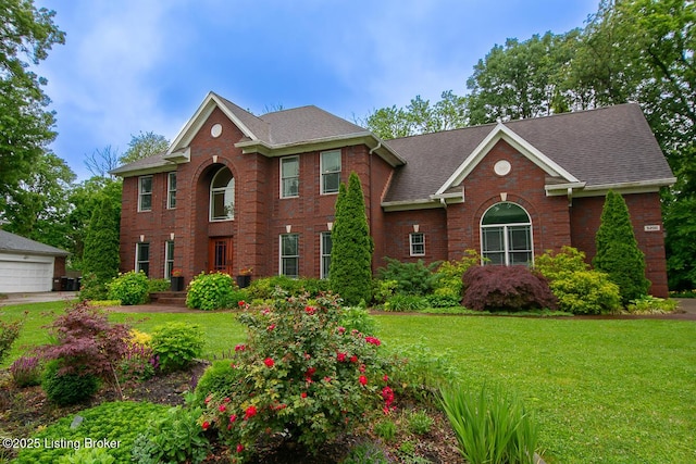 9200 Axminster Dr, Louisville, KY 40299 - view of front facade featuring brick siding, a front lawn, and roof with shingles