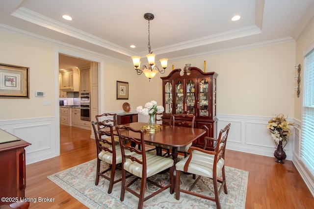 9200 Axminster Dr, Louisville, KY 40299 - dining room with a chandelier, light wood finished floors, crown molding, plenty of natural light, and wainscoting