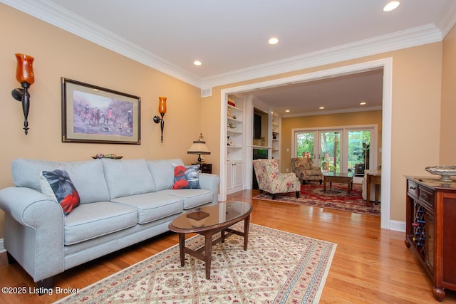 9200 Axminster Dr, Louisville, KY 40299 - living room featuring light wood-style floors, ornamental molding, recessed lighting, and baseboards