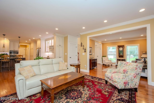 9200 Axminster Dr, Louisville, KY 40299 - living room with ornamental molding, light wood-style flooring, recessed lighting, and baseboards