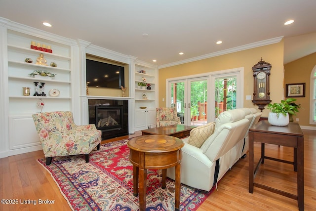 9200 Axminster Dr, Louisville, KY 40299 - living area featuring light wood finished floors, a fireplace with flush hearth, crown molding, recessed lighting, and built in features