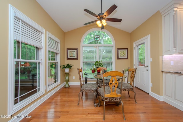 9200 Axminster Dr, Louisville, KY 40299 - dining space with light wood-style flooring, lofted ceiling, ceiling fan, and baseboards