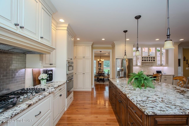 9200 Axminster Dr, Louisville, KY 40299 - kitchen with appliances with stainless steel finishes, a chandelier, tasteful backsplash, healthy amount of natural light, and recessed lighting