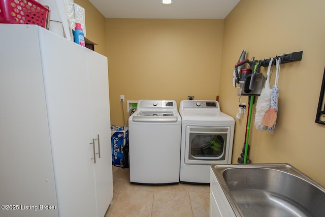 9200 Axminster Dr, Louisville, KY 40299 - laundry room with independent washer and dryer and light tile patterned flooring