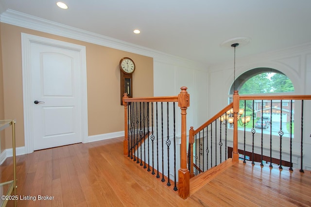 9200 Axminster Dr, Louisville, KY 40299 - stairs featuring wood finished floors, crown molding, baseboards, and recessed lighting