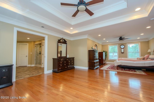 9200 Axminster Dr, Louisville, KY 40299 - bedroom featuring light wood-style flooring, a tray ceiling, recessed lighting, ornamental molding, and baseboards
