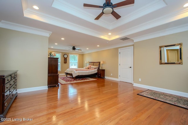 9200 Axminster Dr, Louisville, KY 40299 - bedroom with light wood-type flooring, a tray ceiling, crown molding, recessed lighting, and baseboards
