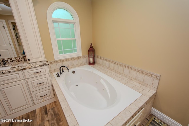 9200 Axminster Dr, Louisville, KY 40299 - bathroom featuring a tub with jets and vanity
