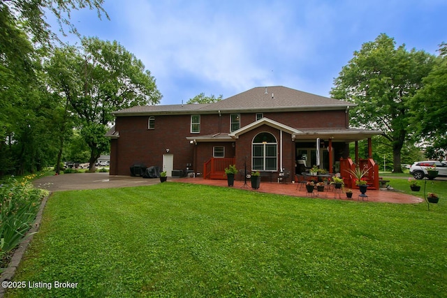 9200 Axminster Dr, Louisville, KY 40299 - back of house with a yard and covered porch
