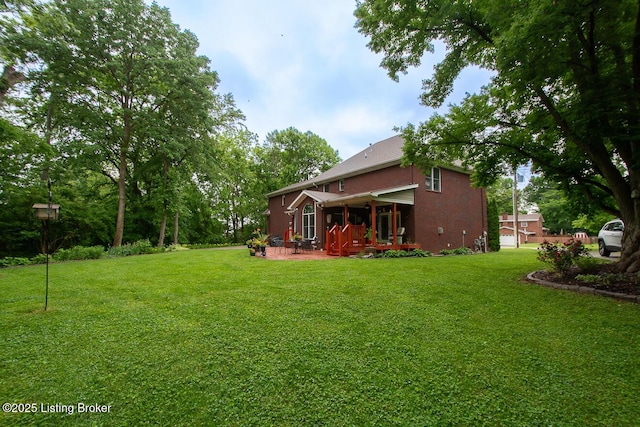 9200 Axminster Dr, Louisville, KY 40299 - view of grassy yard with a patio
