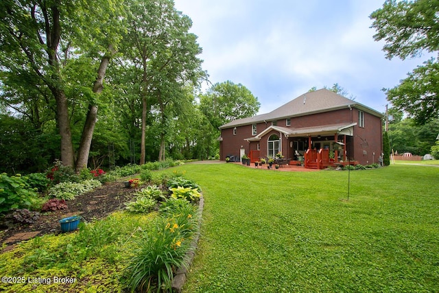 9200 Axminster Dr, Louisville, KY 40299 - view of green lawn featuring a deck