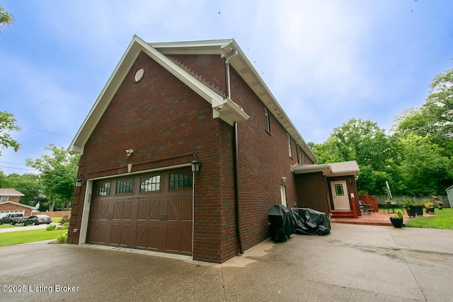 9200 Axminster Dr, Louisville, KY 40299 - view of property exterior with brick siding, asphalt driveway, and a deck