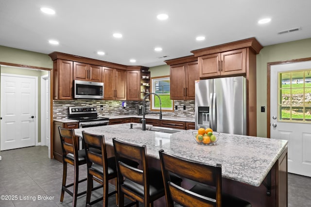 1415 Zoneton Rd, Shepherdsville, KY 40165 - kitchen with appliances with stainless steel finishes, a sink, open shelves, healthy amount of natural light, and recessed lighting