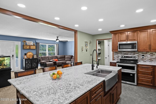 1415 Zoneton Rd, Shepherdsville, KY 40165 - kitchen with appliances with stainless steel finishes, a sink, recessed lighting, decorative backsplash, and ceiling fan