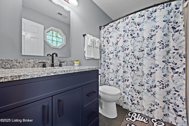 1415 Zoneton Rd, Shepherdsville, KY 40165 - bathroom featuring toilet, vanity, and curtained shower