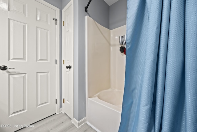 1415 Zoneton Rd, Shepherdsville, KY 40165 - full bath with wood finished floors, baseboards, and shower / bathtub combination with curtain