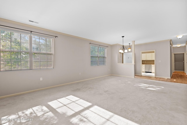 1208 Elderberry Ln, Louisville, KY 40243 - carpeted spare room with a chandelier and crown molding