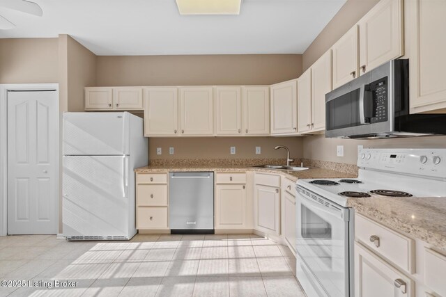 1208 Elderberry Ln, Louisville, KY 40243 - kitchen featuring stainless steel appliances, light tile patterned floors, light stone counters, and white cabinets