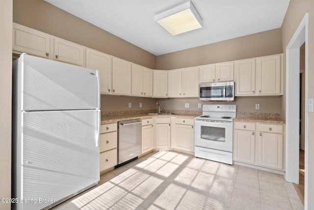 1208 Elderberry Ln, Louisville, KY 40243 - kitchen with appliances with stainless steel finishes, light tile patterned floors, and light stone counters