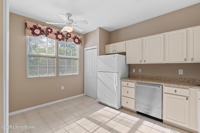 1208 Elderberry Ln, Louisville, KY 40243 - kitchen featuring freestanding refrigerator, stainless steel dishwasher, a ceiling fan, and white cabinets