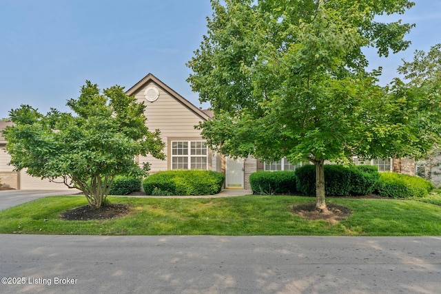 1208 Elderberry Ln, Louisville, KY 40243 - view of property hidden behind natural elements with a front yard
