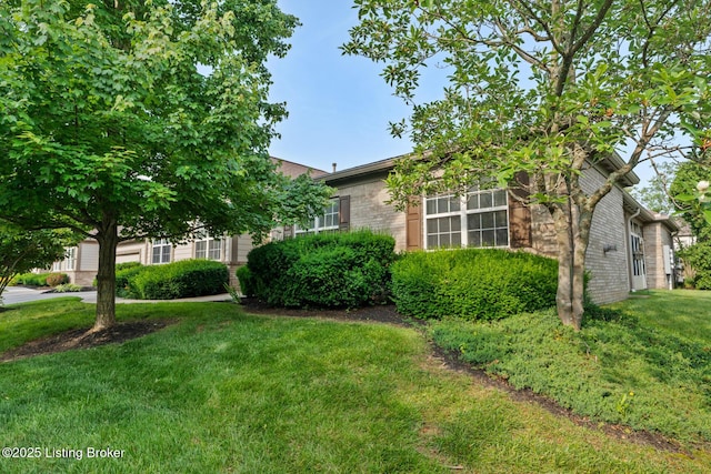 1208 Elderberry Ln, Louisville, KY 40243 - view of front facade featuring brick siding and a front yard