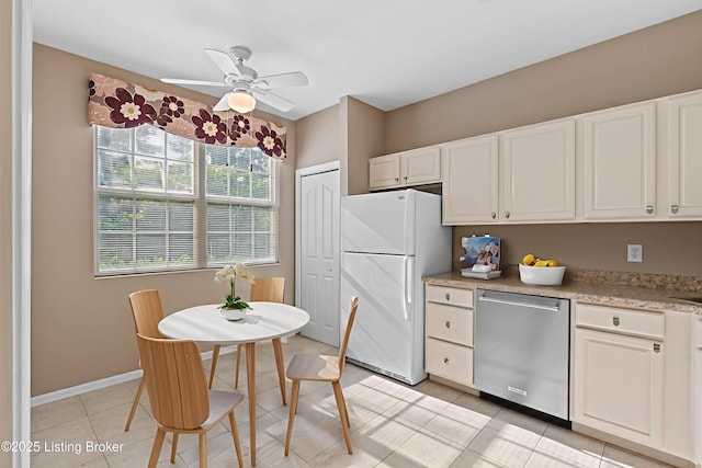 1208 Elderberry Ln, Louisville, KY 40243 - kitchen featuring freestanding refrigerator, stainless steel dishwasher, white cabinets, and a ceiling fan