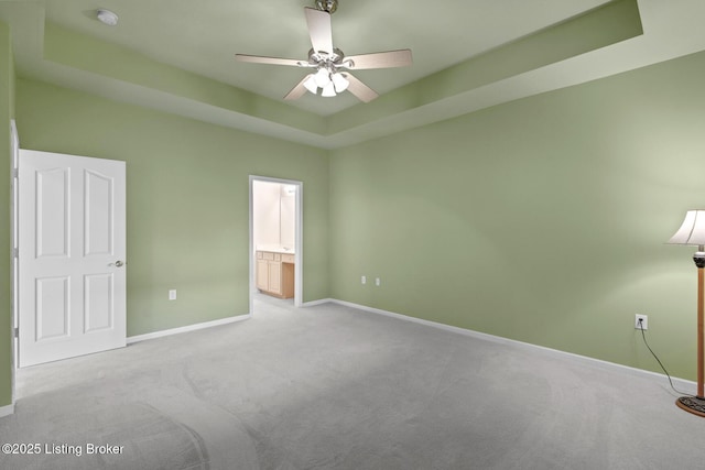 1208 Elderberry Ln, Louisville, KY 40243 - unfurnished bedroom with carpet, ensuite bathroom, a ceiling fan, and a raised ceiling