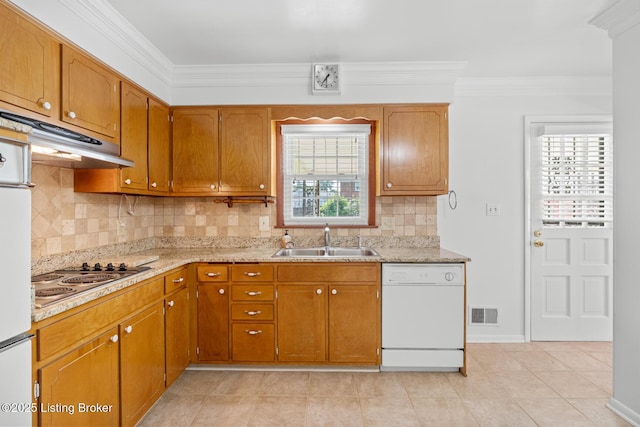 4011 White Plains Ct, Louisville, KY 40218 - kitchen with white dishwasher, stainless steel electric cooktop, crown molding, decorative backsplash, and under cabinet range hood
