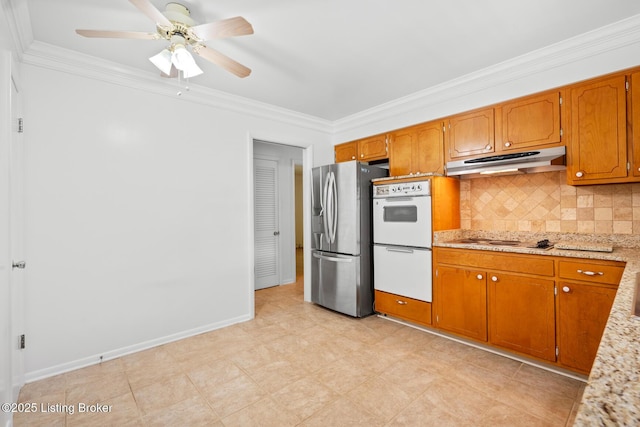 4011 White Plains Ct, Louisville, KY 40218 - kitchen with stainless steel fridge, under cabinet range hood, ornamental molding, double oven, and backsplash