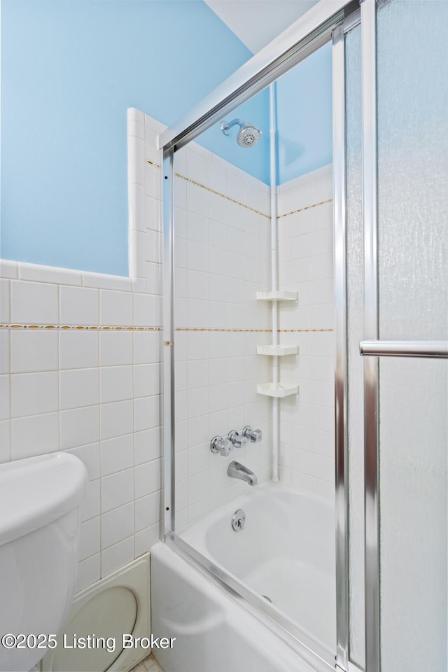 4011 White Plains Ct, Louisville, KY 40218 - bathroom featuring enclosed tub / shower combo, tile walls, and wainscoting