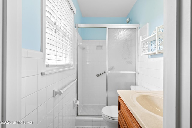 4011 White Plains Ct, Louisville, KY 40218 - bathroom featuring tile walls, a shower stall, and vanity