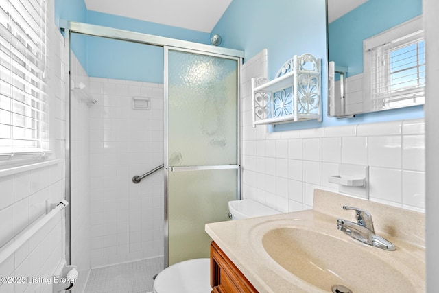 4011 White Plains Ct, Louisville, KY 40218 - full bath with tile walls, a shower stall, and vanity