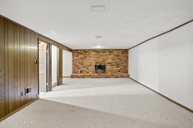 4011 White Plains Ct, Louisville, KY 40218 - unfurnished living room featuring carpet, a brick fireplace, and wood walls