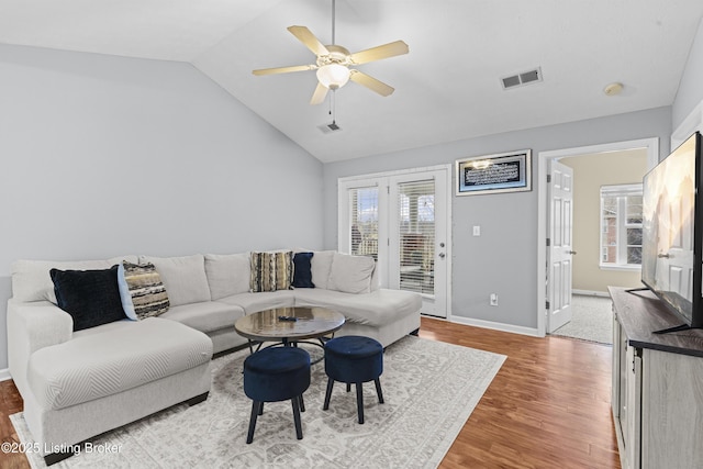 10200 Deer Vista Dr Unit 201, Louisville, KY 40291 - living area with wood finished floors, vaulted ceiling, plenty of natural light, a ceiling fan, and baseboards