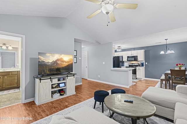 10200 Deer Vista Dr Unit 201, Louisville, KY 40291 - living area featuring light wood-type flooring, lofted ceiling, ceiling fan, a chandelier, and baseboards