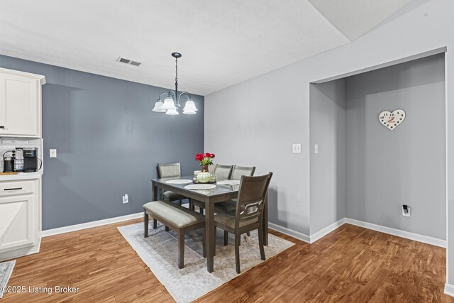 10200 Deer Vista Dr Unit 201, Louisville, KY 40291 - dining area featuring light wood finished floors, a chandelier, and baseboards