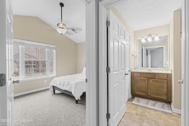 10200 Deer Vista Dr Unit 201, Louisville, KY 40291 - bedroom with lofted ceiling, baseboards, ensuite bath, and ceiling fan