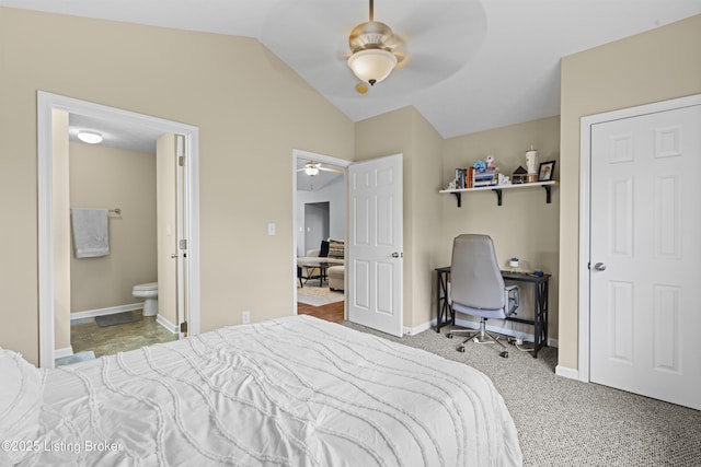 10200 Deer Vista Dr Unit 201, Louisville, KY 40291 - bedroom with lofted ceiling, baseboards, a desk, ensuite bath, and carpet flooring