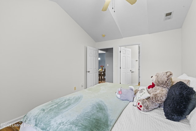 10200 Deer Vista Dr Unit 201, Louisville, KY 40291 - bedroom featuring lofted ceiling, wood finished floors, a ceiling fan, and baseboards