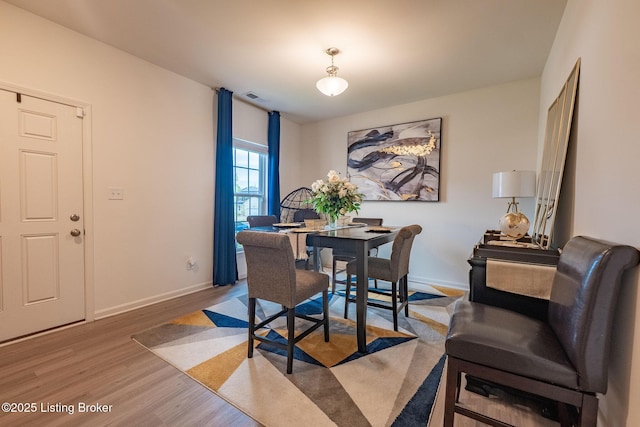 11905 Cascade Falls Trl, Louisville, KY 40229 - dining room with light wood-style floors and baseboards
