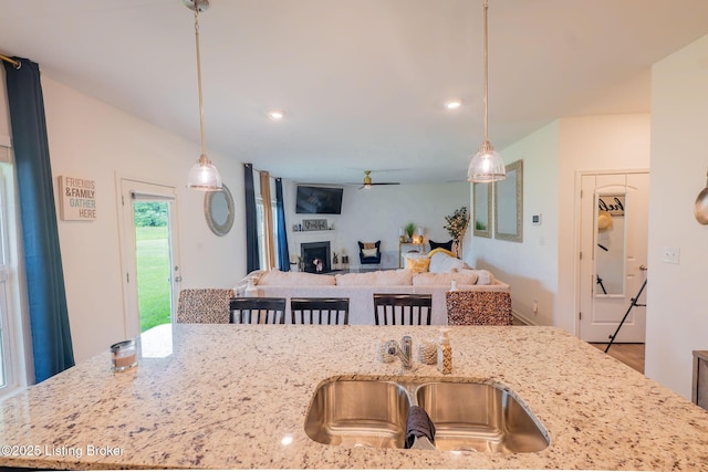 11905 Cascade Falls Trl, Louisville, KY 40229 - kitchen with ceiling fan, pendant lighting, open floor plan, light stone counters, and recessed lighting
