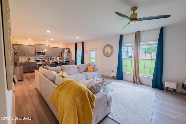 11905 Cascade Falls Trl, Louisville, KY 40229 - living room featuring plenty of natural light, recessed lighting, ceiling fan, and light wood-style floors
