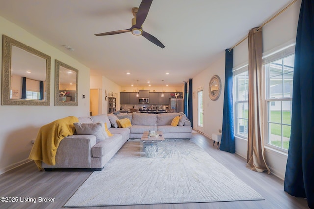 11905 Cascade Falls Trl, Louisville, KY 40229 - living room with light wood-style flooring, plenty of natural light, baseboards, and recessed lighting