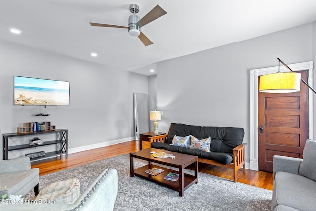 living area with ceiling fan, wood finished floors, recessed lighting, and baseboards