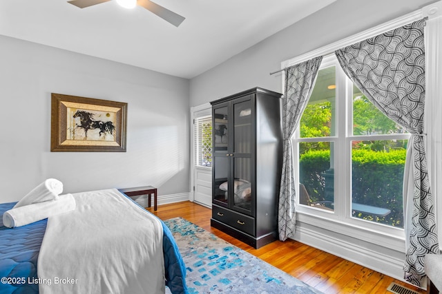 bedroom with wood finished floors and a ceiling fan