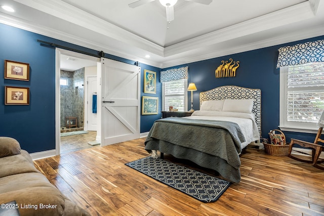 17900 Meremont Heights Way, Louisville, KY 40245 - bedroom with a barn door, multiple windows, hardwood / wood-style floors, a raised ceiling, and ornamental molding